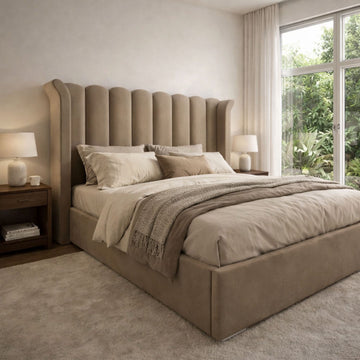 Bedroom layout ideas UK — upholstered bed positioned in a UK bedroom